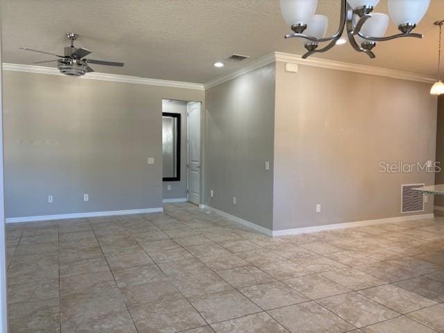 spare room with ornamental molding, ceiling fan with notable chandelier, a textured ceiling, and light tile patterned floors