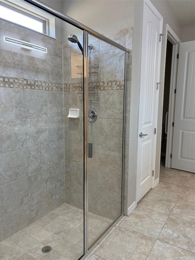 bathroom with an enclosed shower