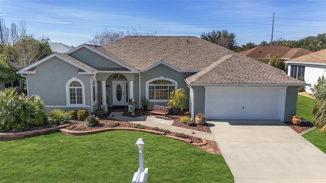 ranch-style home featuring a garage and a front yard