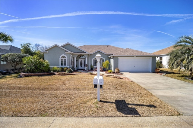 ranch-style house featuring a garage and a front lawn