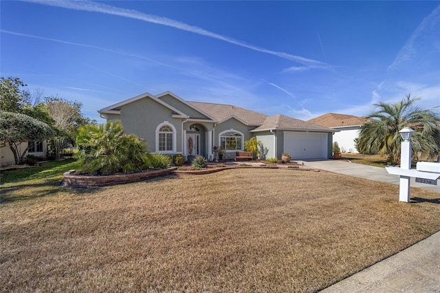 single story home with a garage and a front lawn