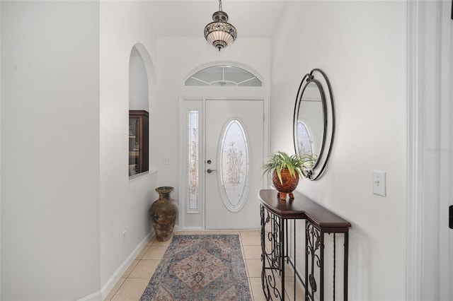 foyer entrance with light tile patterned floors