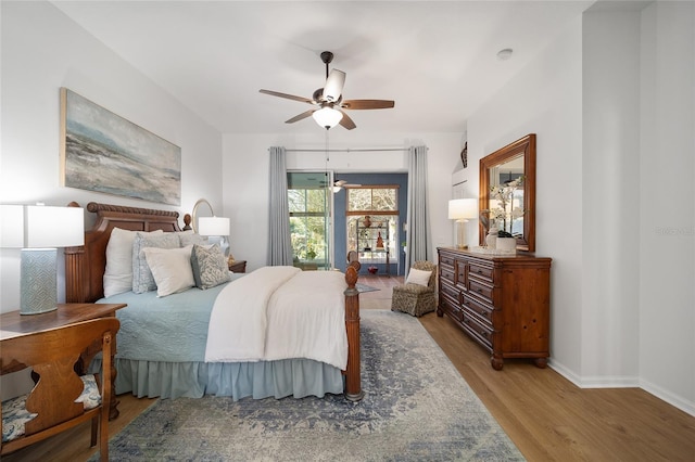 bedroom with light hardwood / wood-style flooring and ceiling fan