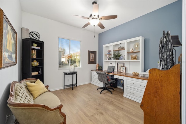 office area with light hardwood / wood-style flooring and ceiling fan