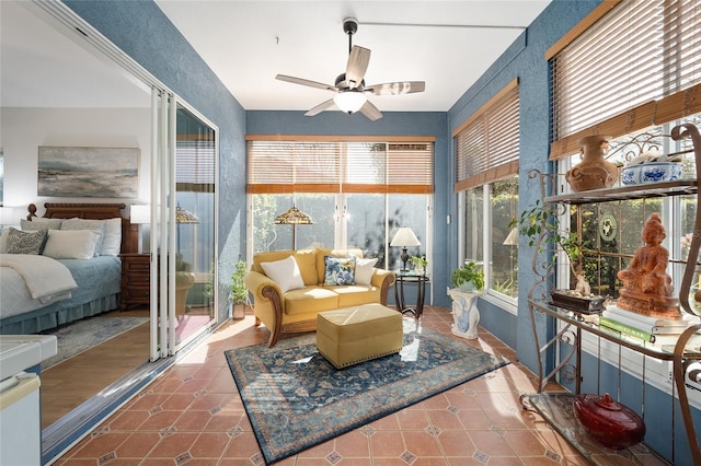 sunroom / solarium with ceiling fan