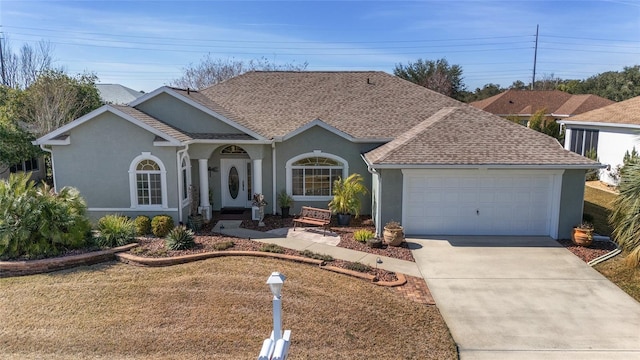 single story home featuring a garage and a front yard