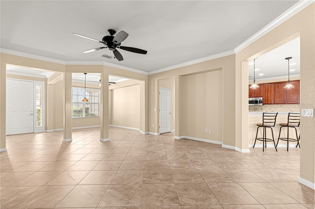 interior space with crown molding, light tile patterned floors, and ceiling fan