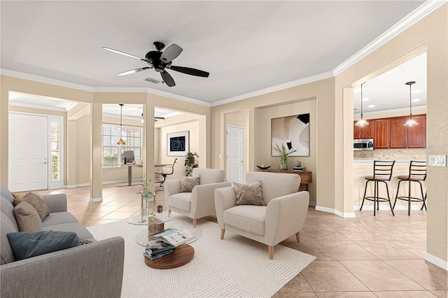 tiled living room featuring crown molding and ceiling fan