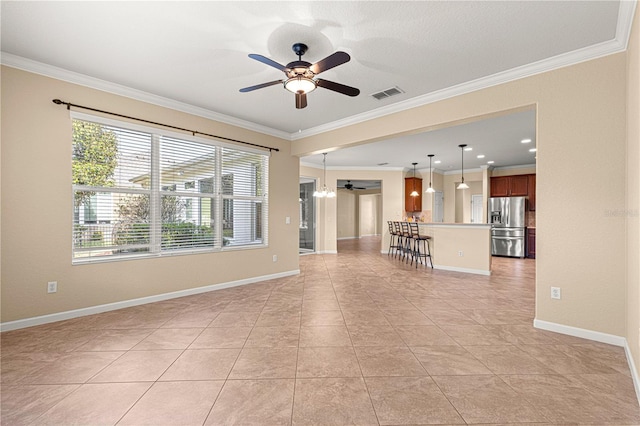 unfurnished living room with ornamental molding, light tile patterned floors, and ceiling fan