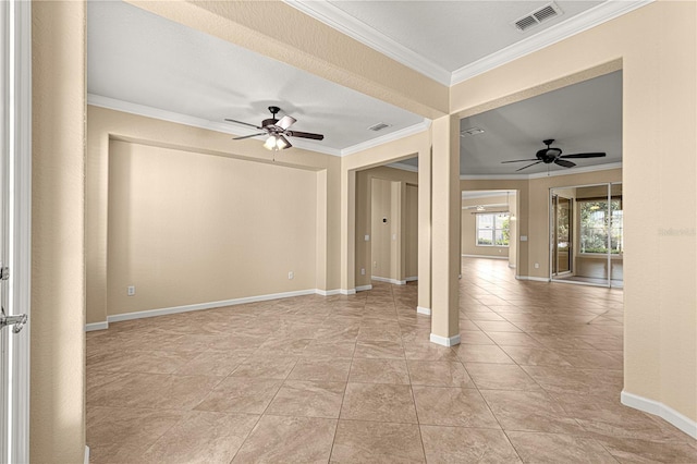 spare room featuring ceiling fan, ornamental molding, and light tile patterned floors