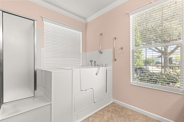 laundry area with crown molding, light tile patterned flooring, and hookup for a washing machine