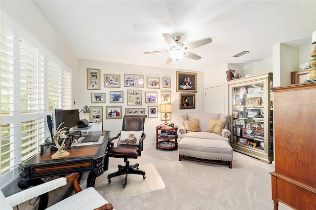 home office with light colored carpet and ceiling fan