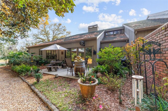 back of property featuring a patio