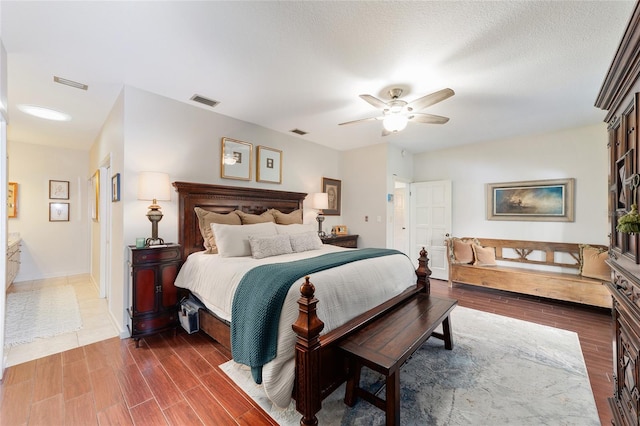 bedroom featuring ceiling fan and dark hardwood / wood-style flooring