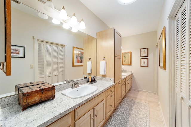 bathroom featuring tile patterned floors and vanity