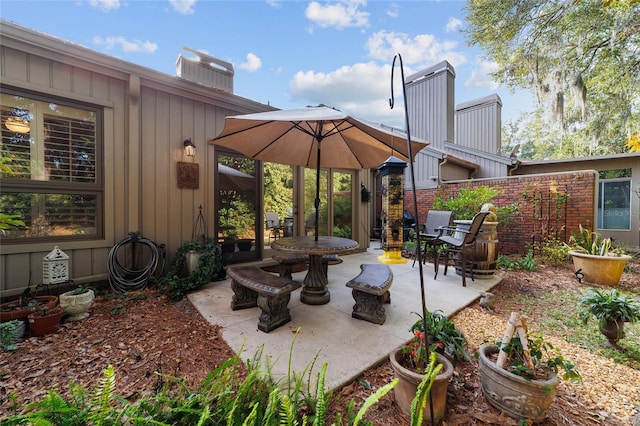 view of patio / terrace with an outdoor fire pit