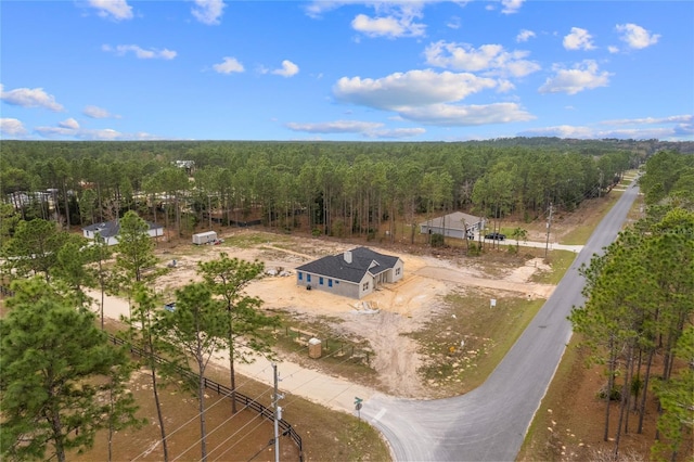 aerial view featuring a view of trees