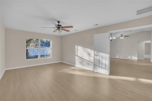 empty room with ceiling fan and light wood-type flooring