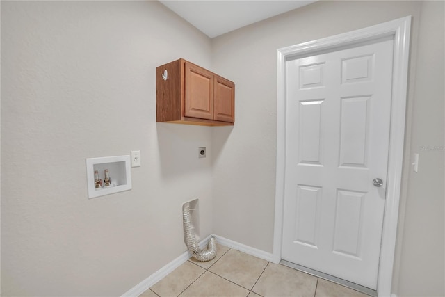 laundry room featuring cabinets, hookup for an electric dryer, hookup for a washing machine, and light tile patterned floors