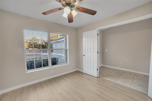 spare room with ceiling fan and light hardwood / wood-style floors