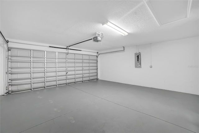 garage featuring a garage door opener and electric panel