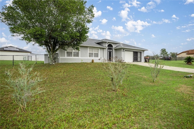 ranch-style house with stucco siding, a front yard, fence, a garage, and driveway