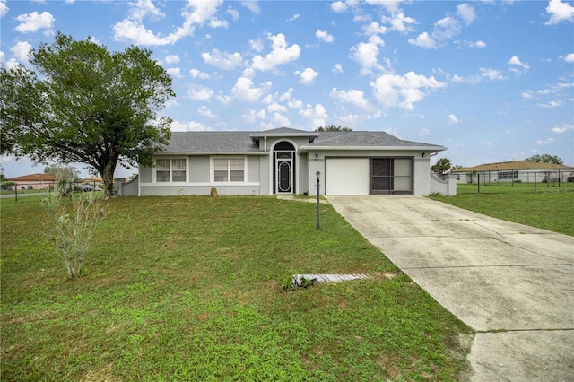 ranch-style house with a garage, fence, driveway, stucco siding, and a front lawn