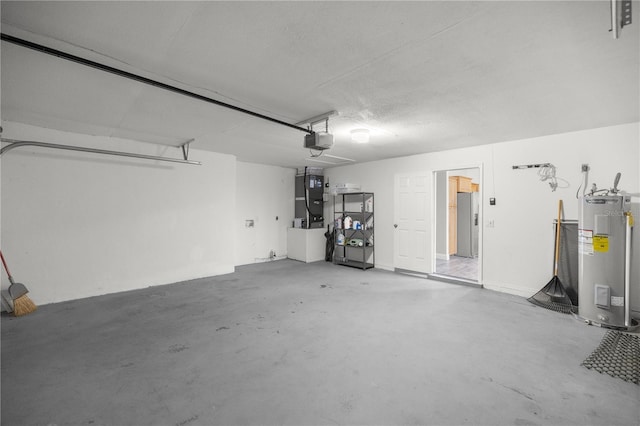 garage featuring heating unit, electric water heater, and a garage door opener