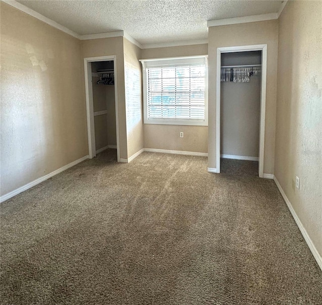 unfurnished bedroom featuring carpet floors, ornamental molding, and a textured ceiling