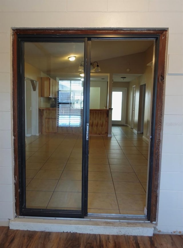 corridor featuring tile patterned flooring