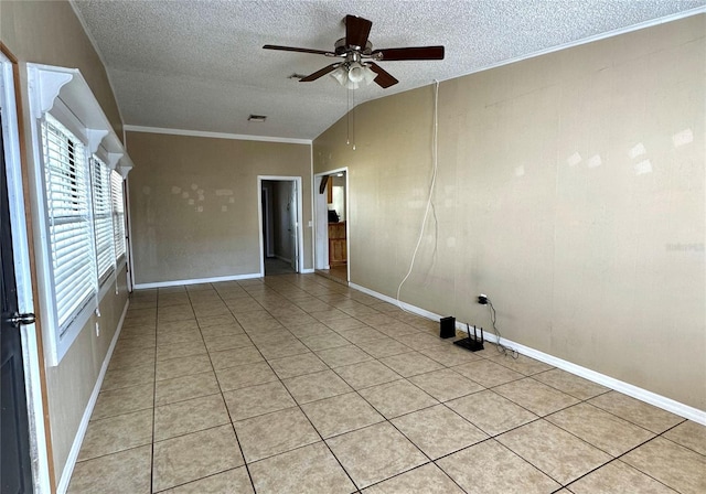 unfurnished room with light tile patterned floors, crown molding, vaulted ceiling, and a textured ceiling