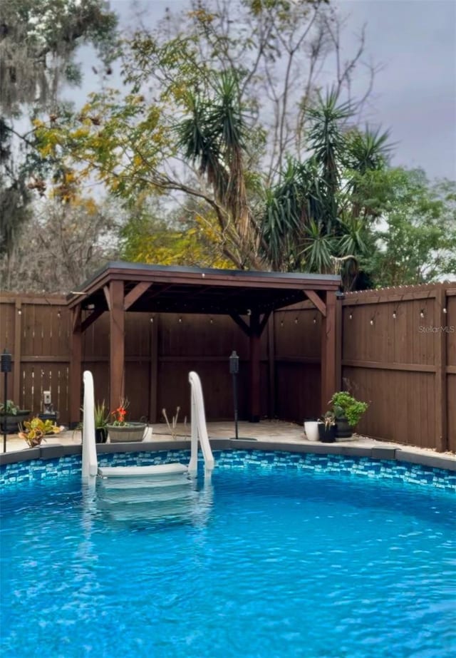 view of pool with a water slide