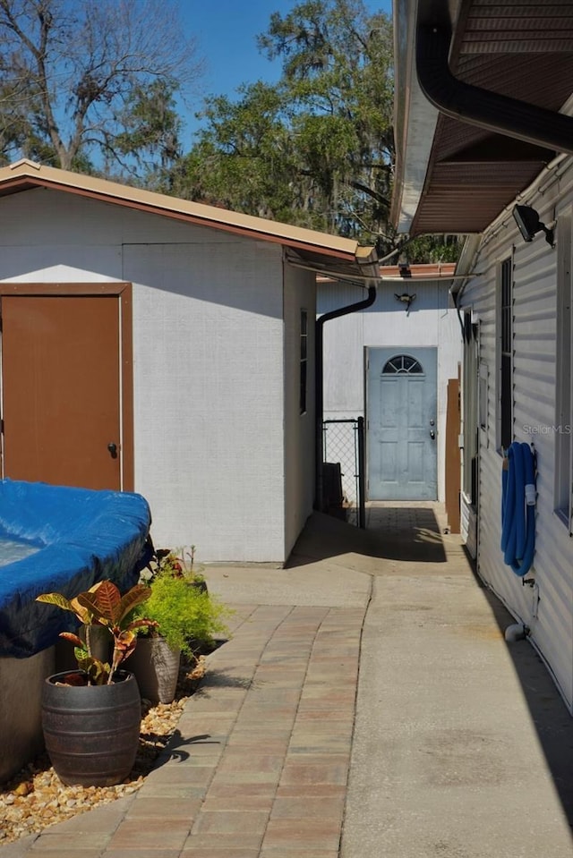 view of side of property with a patio area