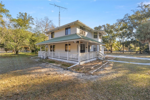 farmhouse-style home featuring a porch