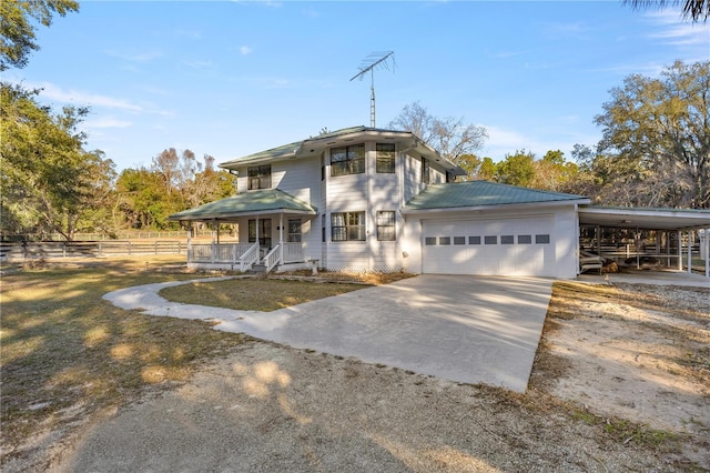 view of front of property with a garage and covered porch