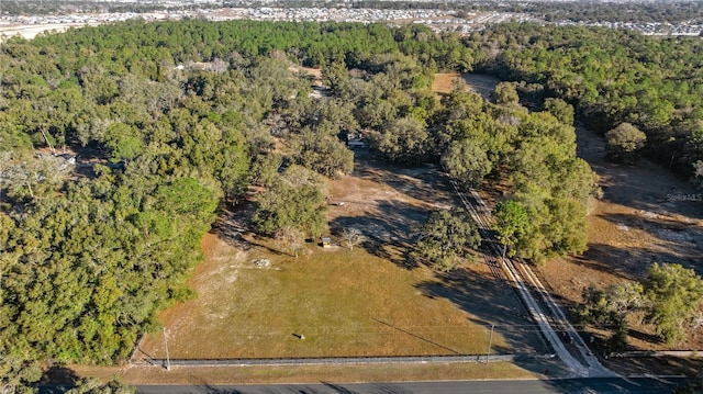 bird's eye view featuring a forest view