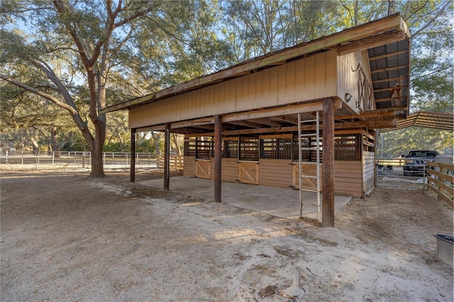 exterior space featuring a detached carport and an exterior structure