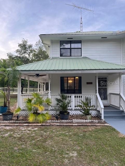 10245 SW 105th St, Ocala, FL 34481 - farmhouse inspired home featuring covered porch and a front lawn