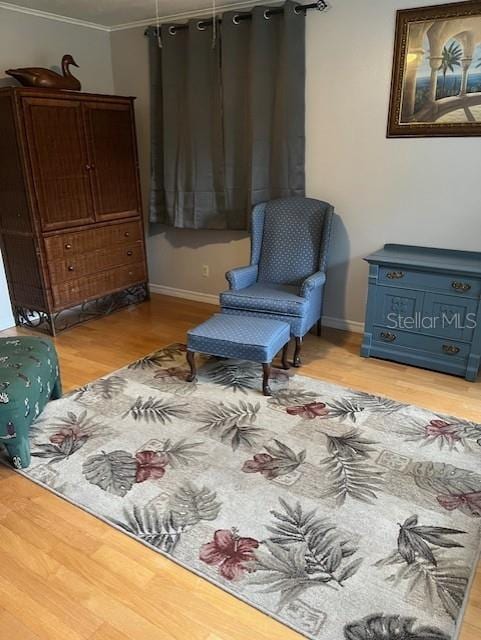 10245 SW 105th St, Ocala, FL 34481 - sitting room with wood finished floors, crown molding, and baseboards