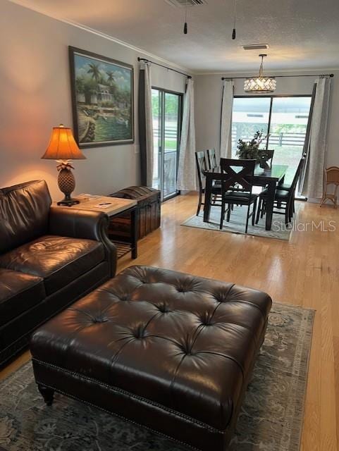 10245 SW 105th St, Ocala, FL 34481 - living area featuring light wood-type flooring and crown molding
