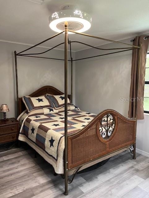 10245 SW 105th St, Ocala, FL 34481 - bedroom featuring light wood-type flooring, ornamental molding, and baseboards
