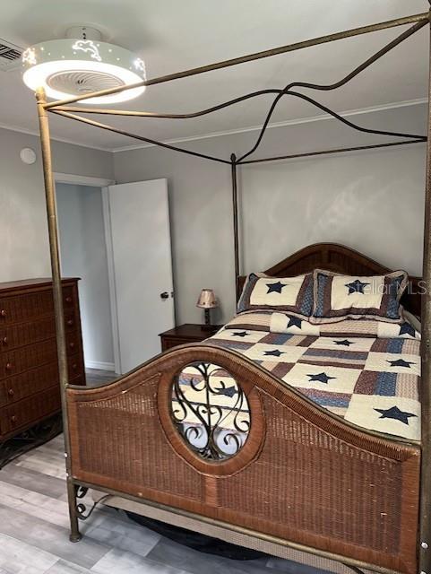 10245 SW 105th St, Ocala, FL 34481 - bedroom featuring tile patterned floors and ornamental molding