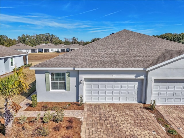 single story home featuring a garage