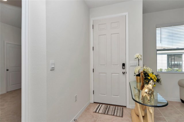 entrance foyer with light tile patterned floors