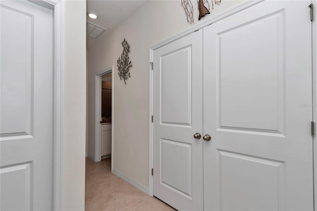 hallway featuring light tile patterned floors