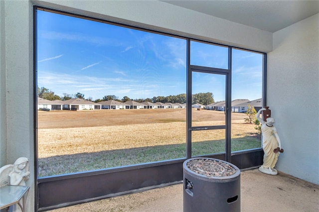 unfurnished sunroom featuring plenty of natural light