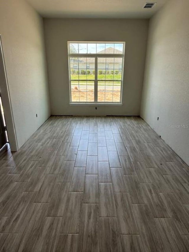 13 NW 45th Loop, Ocala, FL 34475 - empty room featuring dark wood-style floors