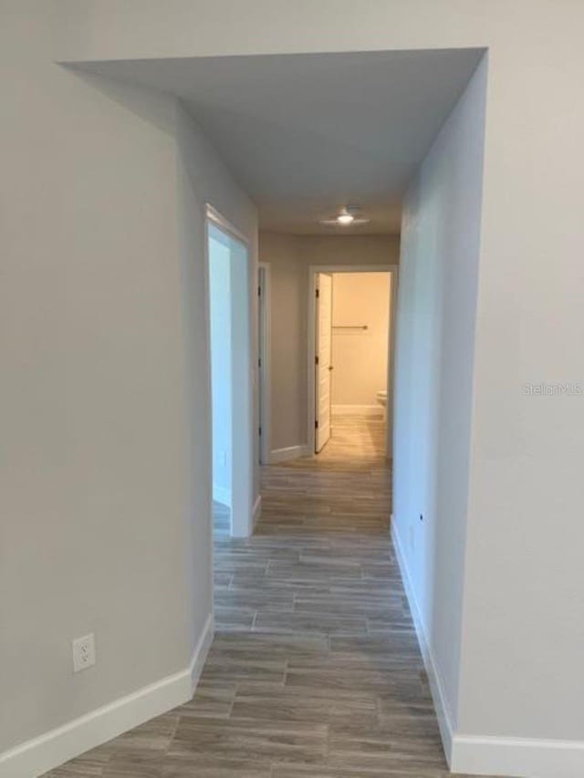 13 NW 45th Loop, Ocala, FL 34475 - hall with baseboards and wood finished floors