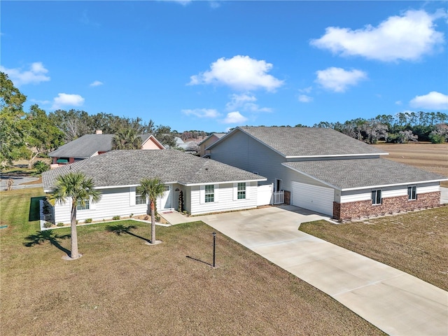 ranch-style house with a garage, central AC, and a front lawn