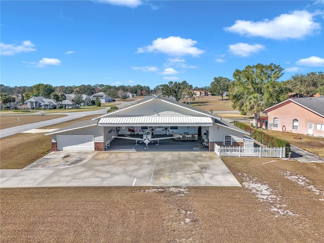 view of front facade with a carport